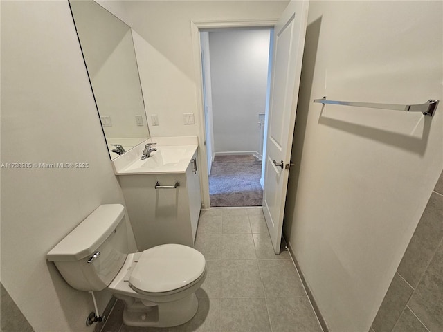 bathroom with tile patterned flooring, sink, and toilet