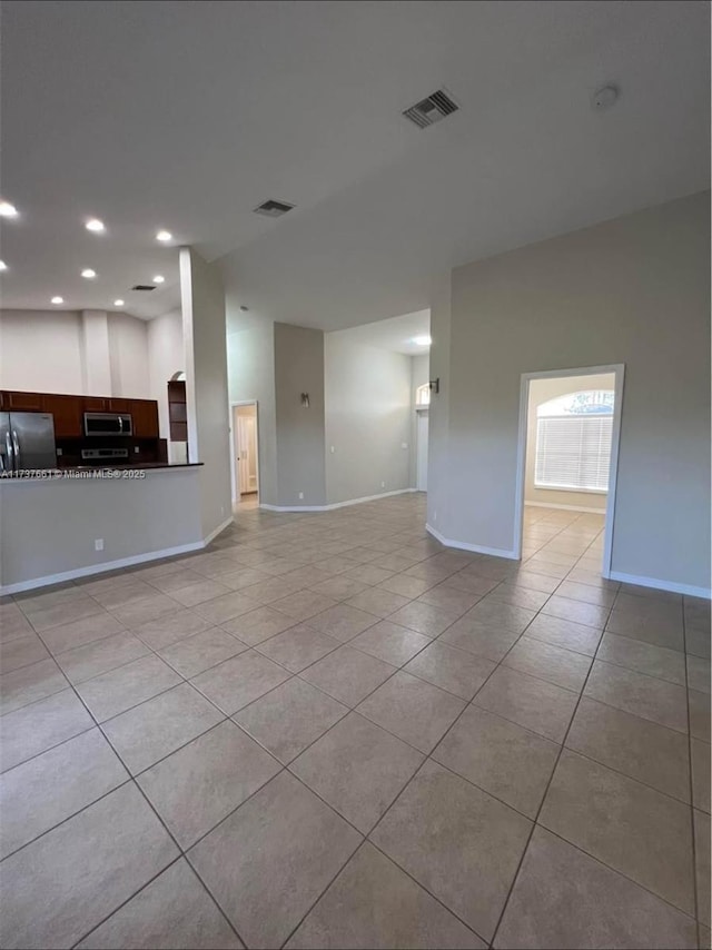 unfurnished living room with light tile patterned floors