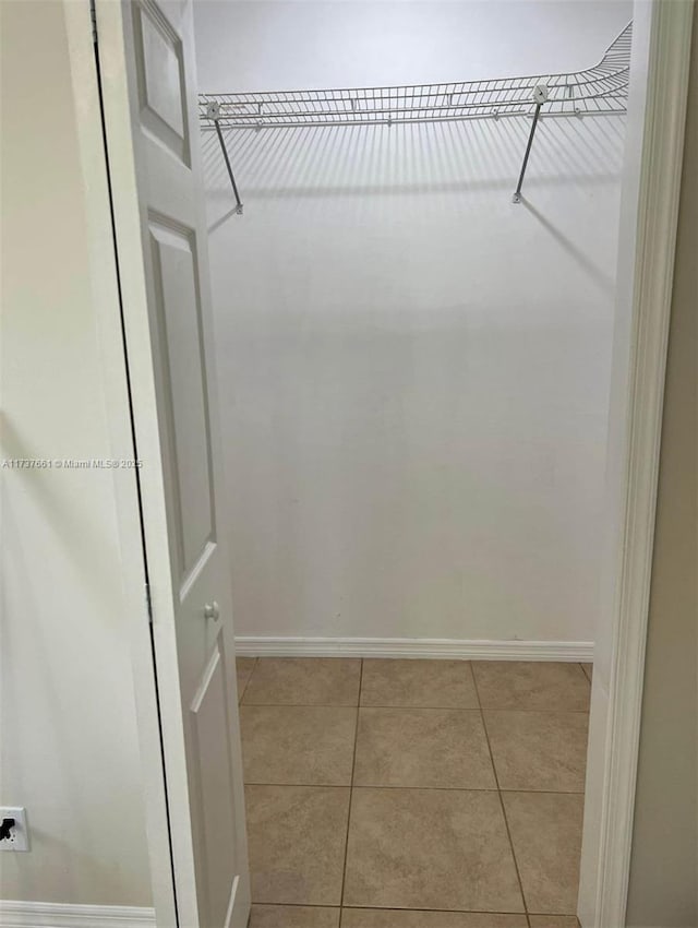 walk in closet featuring light tile patterned floors