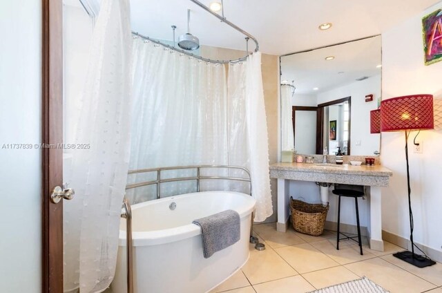 bathroom featuring independent shower and bath and tile patterned flooring