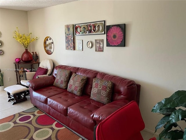 living room featuring light tile patterned flooring and a textured ceiling