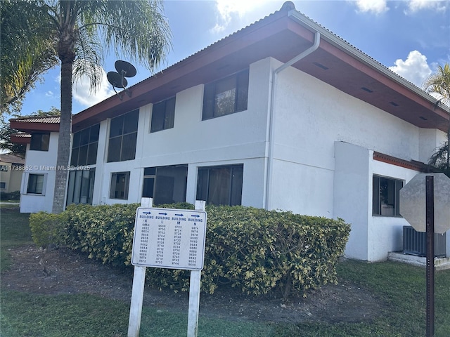 view of side of home with cooling unit