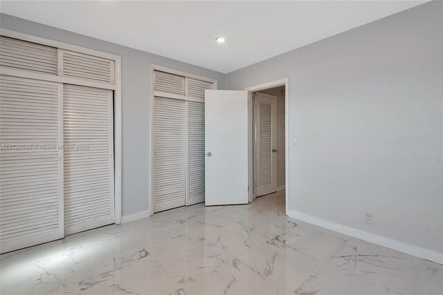 entrance foyer featuring an AC wall unit