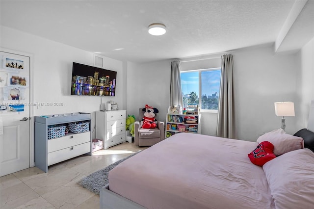 bedroom with a textured ceiling