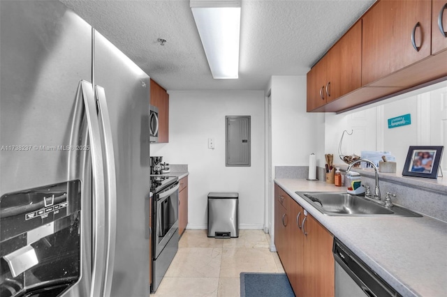 kitchen featuring sink, appliances with stainless steel finishes, electric panel, a textured ceiling, and light tile patterned flooring