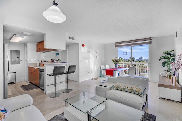 living room with sink and a textured ceiling