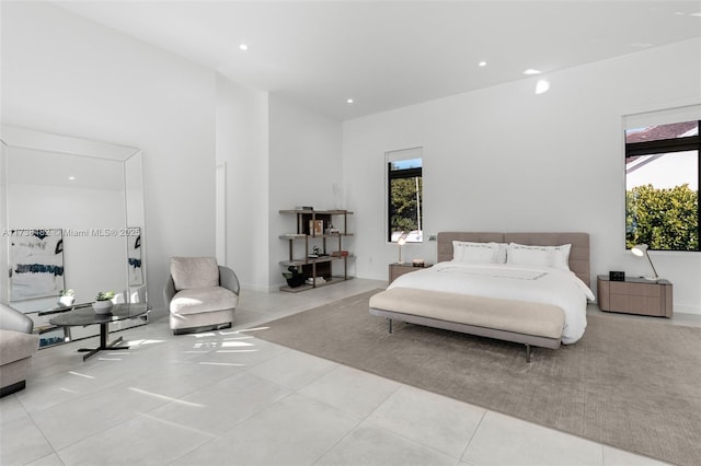 bedroom with light tile patterned floors