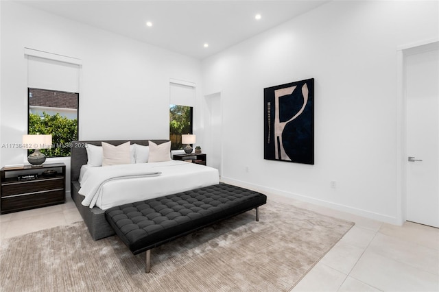 bedroom with light tile patterned floors