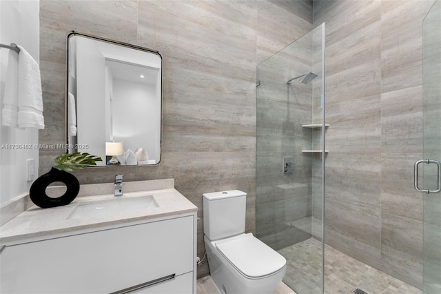 bathroom featuring walk in shower, vanity, and toilet