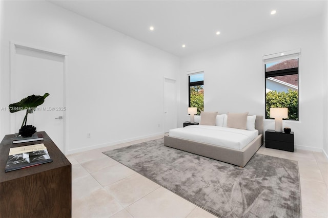 bedroom with light tile patterned floors