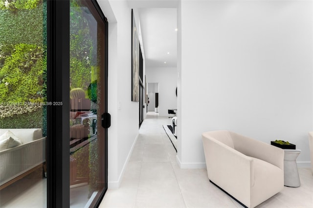 hall with light tile patterned floors