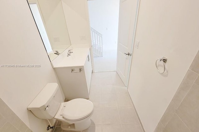 bathroom with vanity, tile patterned floors, and toilet