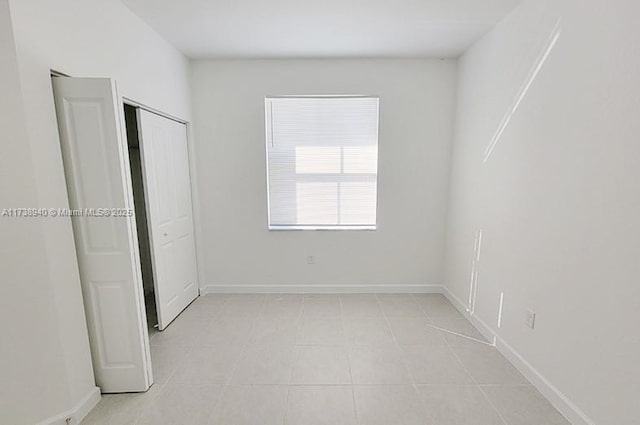 unfurnished bedroom with a closet