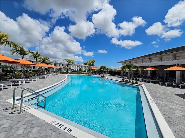 view of swimming pool with a patio