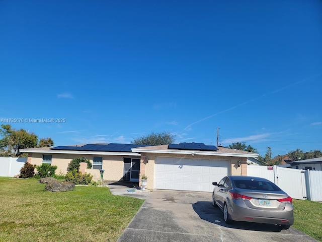 single story home with a garage and a front yard