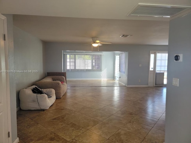 living room featuring ceiling fan and light tile patterned floors