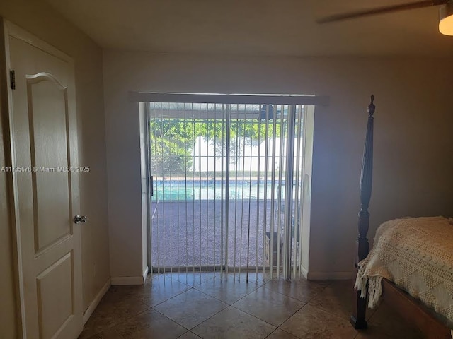 bedroom with light tile patterned floors