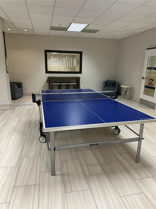 game room featuring a drop ceiling