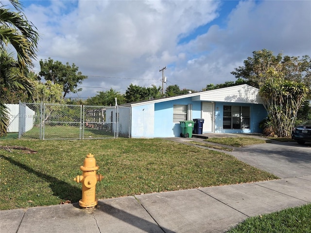 ranch-style home with a front yard