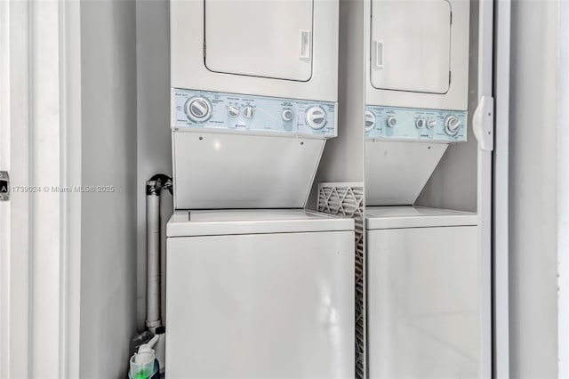 laundry area with stacked washer / dryer