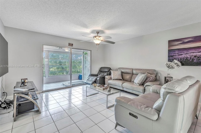 tiled living room featuring ceiling fan and a textured ceiling