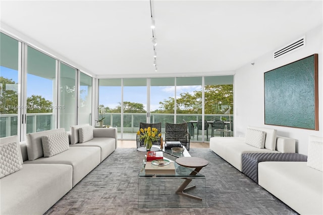 2127 Brickell Ave Unit 705, Miami, FL 33129 - living area featuring rail lighting, plenty of natural light, and expansive windows