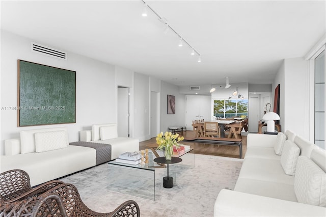 2127 Brickell Ave Unit 705, Miami, FL 33129 - living area featuring wood finished floors and track lighting
