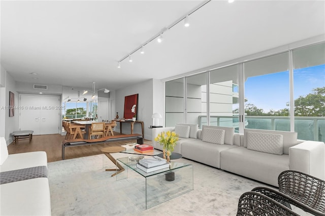 2127 Brickell Ave Unit 705, Miami, FL 33129 - living room with wood finished floors and track lighting