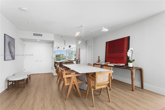 2127 Brickell Ave Unit 705, Miami, FL 33129 - dining space featuring light wood-type flooring and baseboards