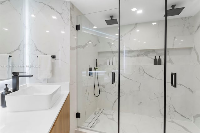 2127 Brickell Ave Unit 705, Miami, FL 33129 - bathroom featuring vanity and a marble finish shower