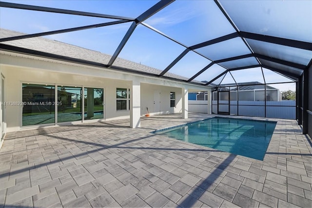 view of pool featuring a lanai and a patio area