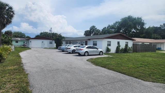 ranch-style house with a front lawn