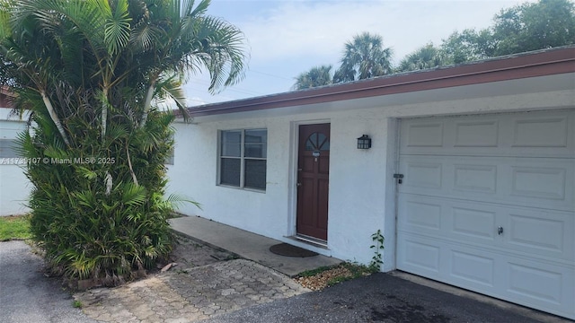 property entrance with a garage