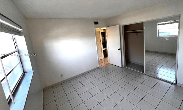 2145 Pierce St Unit 105, Hollywood, FL 33020 - unfurnished bedroom featuring a closet and light tile patterned floors
