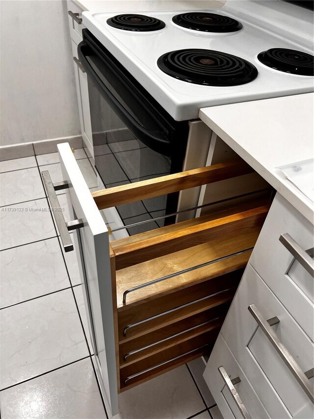 details featuring range with electric stovetop