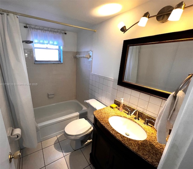 full bathroom featuring tile walls, tile patterned flooring, vanity, toilet, and shower / bath combo with shower curtain