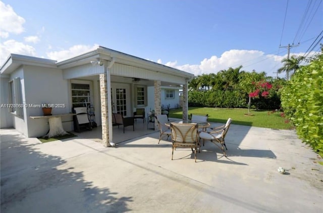 view of patio / terrace with ceiling fan