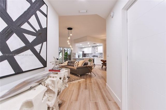 hallway with light wood-type flooring