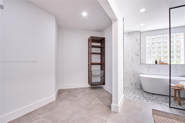 bathroom featuring separate shower and tub and tile patterned flooring