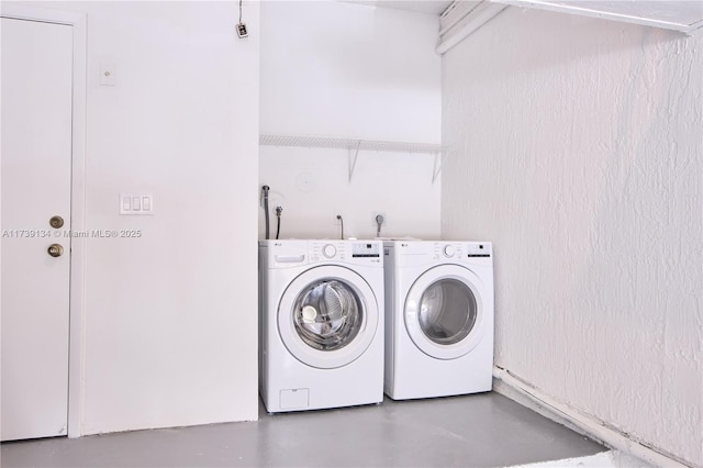 laundry room featuring washer and clothes dryer