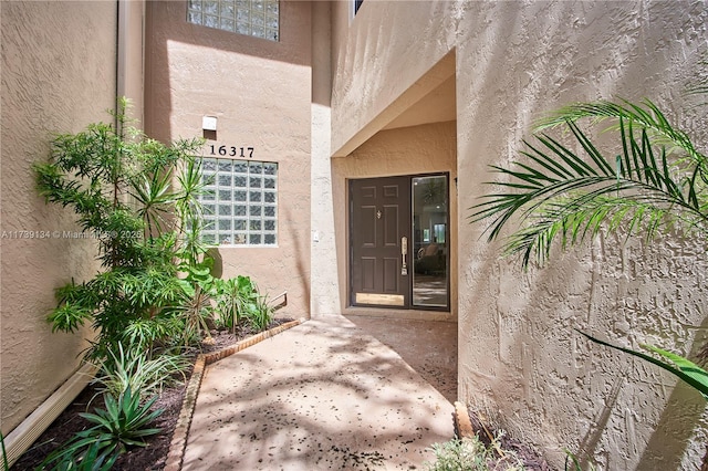 doorway to property featuring a patio area