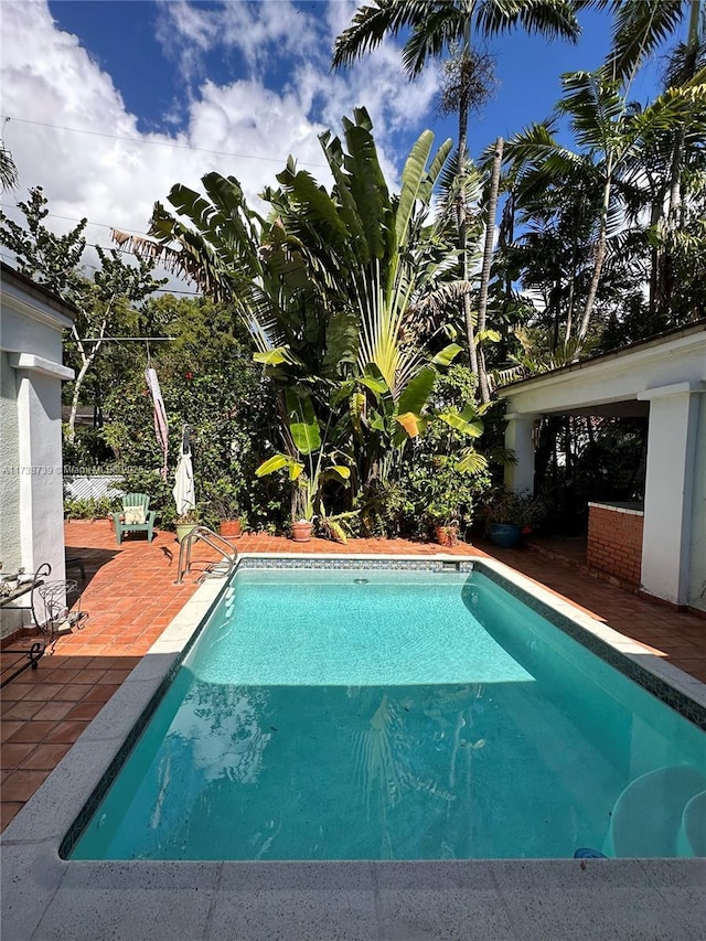 pool with a patio