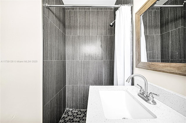 bathroom with sink and curtained shower