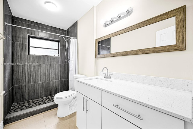 bathroom with vanity, walk in shower, tile patterned floors, and toilet