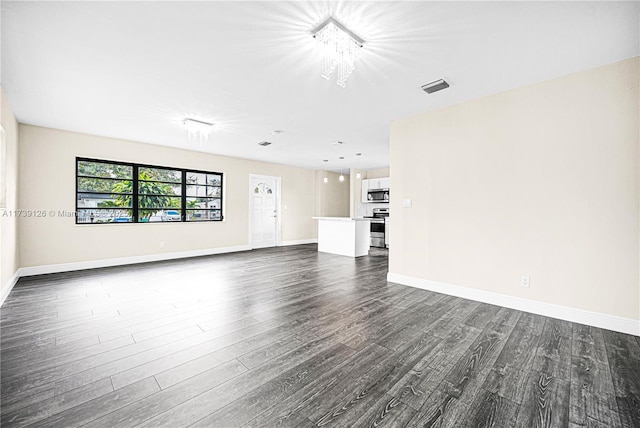 unfurnished living room with dark hardwood / wood-style flooring