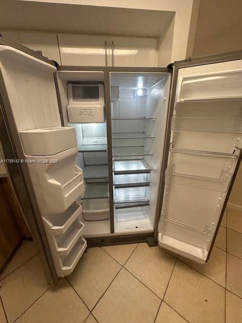 interior details with stainless steel refrigerator