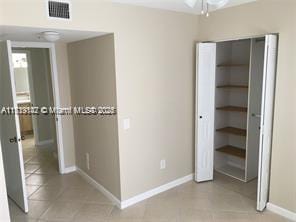 unfurnished bedroom featuring light tile patterned floors