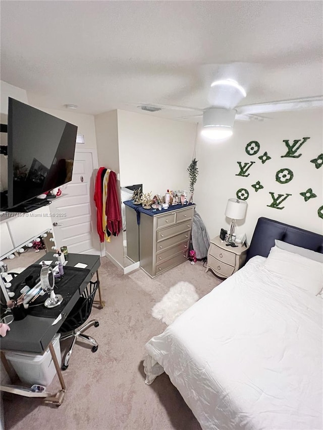 carpeted bedroom with a textured ceiling