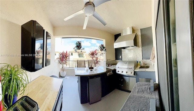 view of patio with grilling area, ceiling fan, and an outdoor wet bar