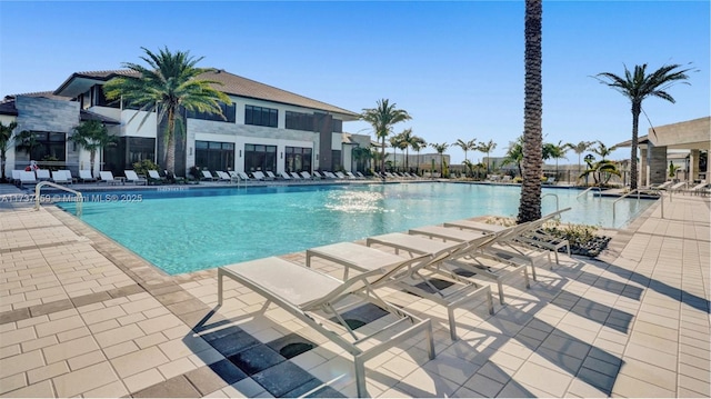 view of swimming pool with a patio